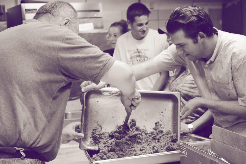WHATS THE SCOOP: Local Food Recovery Network co-founder Austin Adam collects donated food on Sept. 6. The Bellarmine University chapter donates food that would otherwise be discarded to local shelters. 
