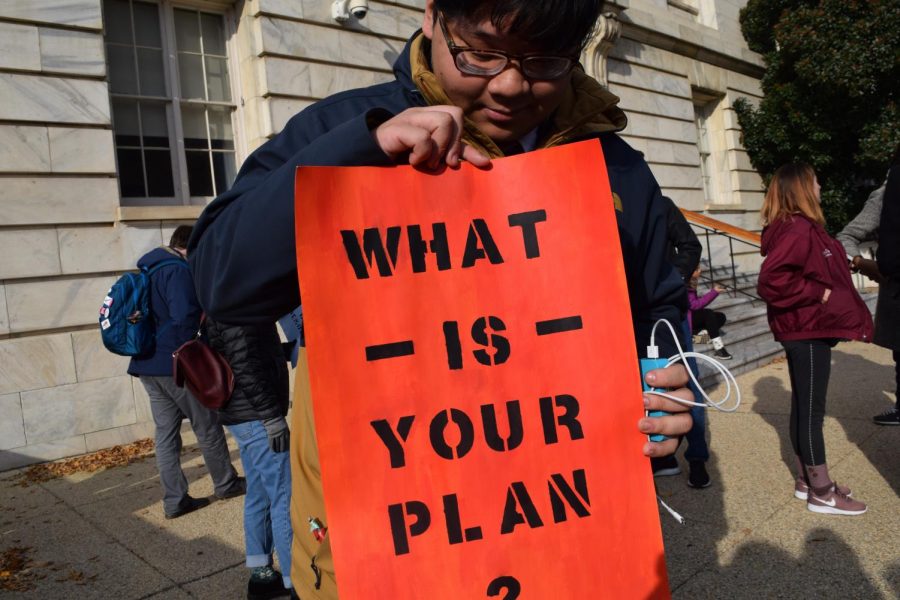 Man With A Plan - Chris Tran holds up his sign in Washington, D.C. on Dec. 10 as he prepares to lobby Congress. Photo by Francisco Mendes