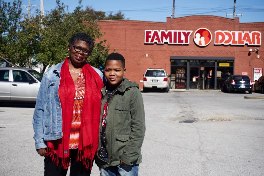 On Oct. 8, Jackie Floyd stands with her grandson,Shaun Cooksey, outside of a Family Dollar on 15th Street and Market Street that attempted to obtain a liquor license. Why should the community accept the fact that even more liquor is being put into their community? Floyd said. Photo by Marshall Gault