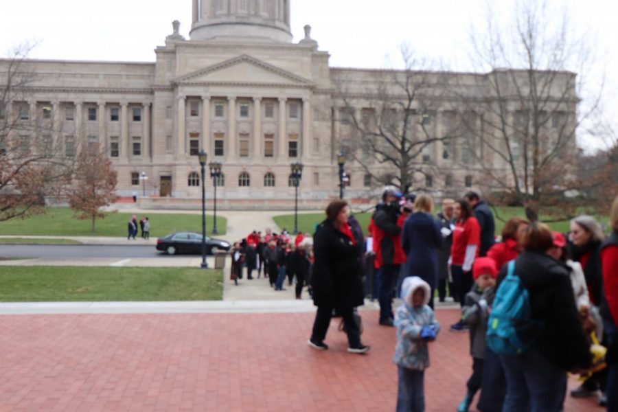 RED WAVE - Teachers line up outside the annex building of the capitol in Frankfurt, Kentucky to protest HB 525. Photo by Sylvia Cassidy