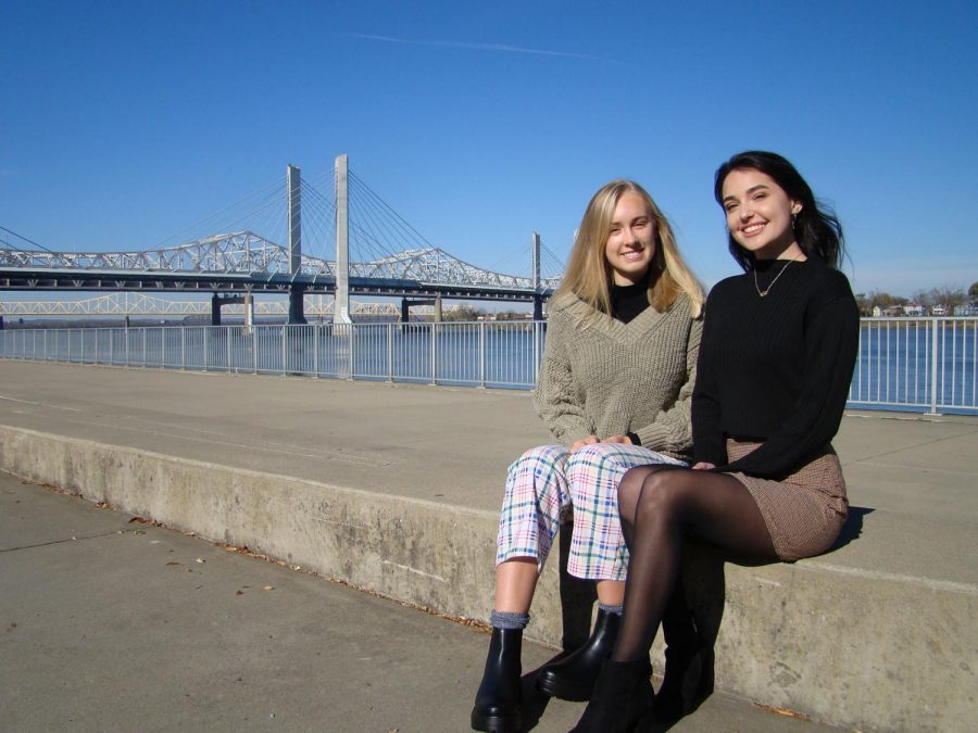 The Waterfront Park, a non-profit, public park that showcases the Ohio River and the Big Four Bridge, lies in the background as Maren and Brynna pose in bottoms from their clothing line on Nov. 18, 2020.