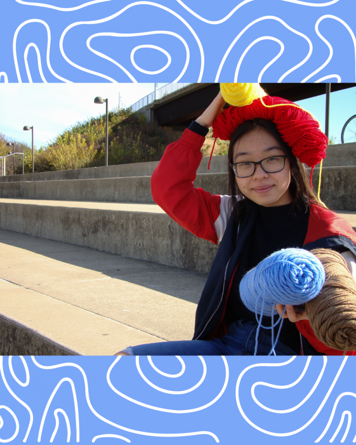 16-year-old Ashley Phan poses on the steps in front of the Ohio River on Nov. 18, 2020 with some of the yarn she utilizes for her small business.