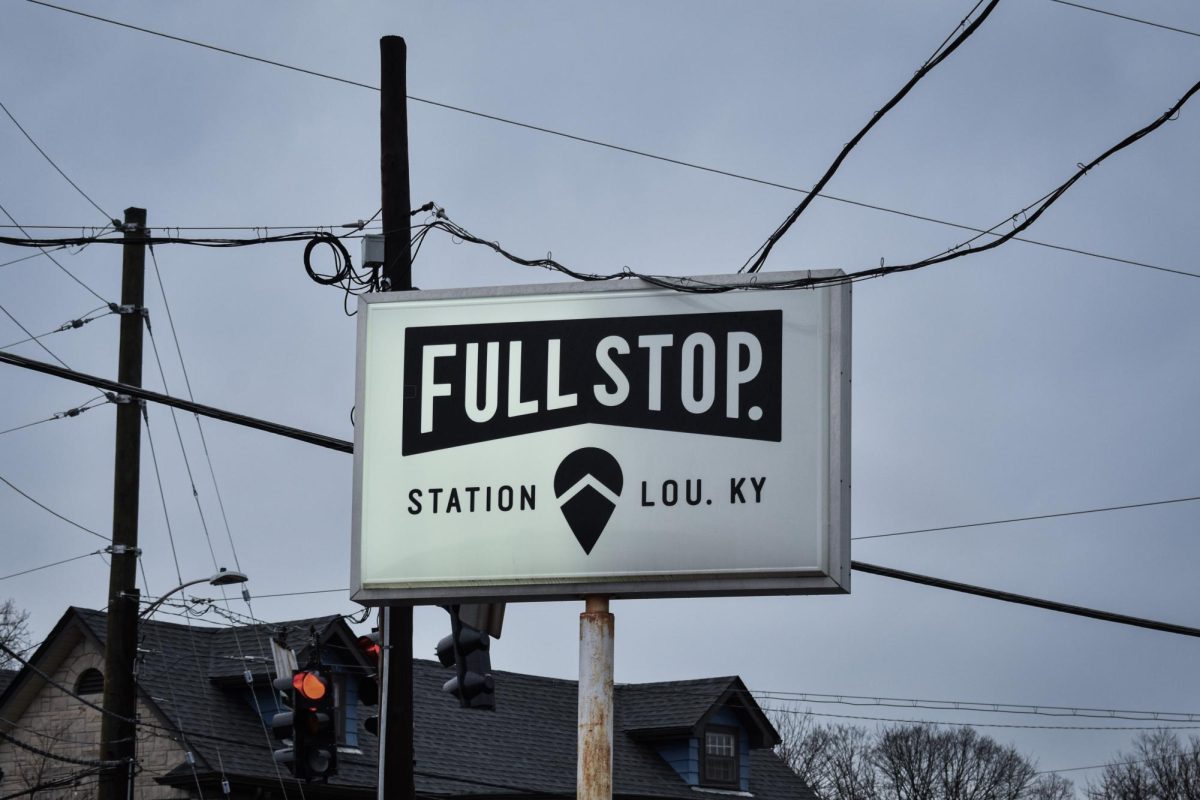 Stopping By: The local sign of Full Stop Station cafe stands in Germantown on Dec. 16, inviting customers to stop by.