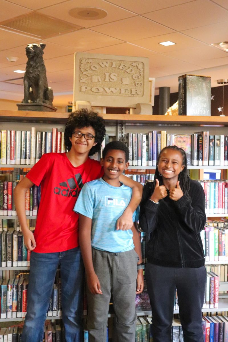 Growing as a Team - Shaardul Basnet, 13, Elshaday Nigussie, 12 and Naomi
Alemneh, 13, meet at the Main Library on Oct. 23. They are all seventh
graders at Meyzeek Middle School and meet at the library multiple times a
week to utilize its resources.