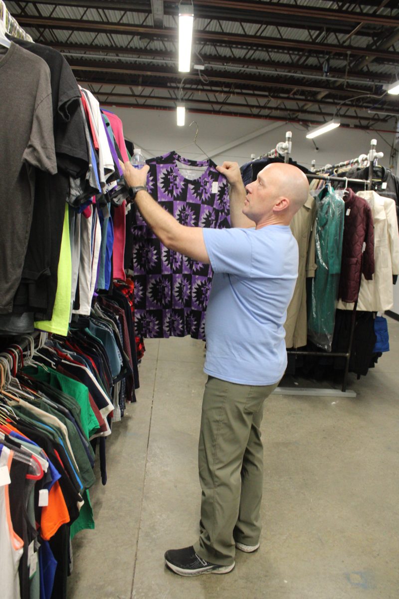 An Equitable Resource - Justin Willis, the manager of the Clothing Assistance Program, sorts through the facility’s clothing storage in Louisville, Kentucky on Oct. 23