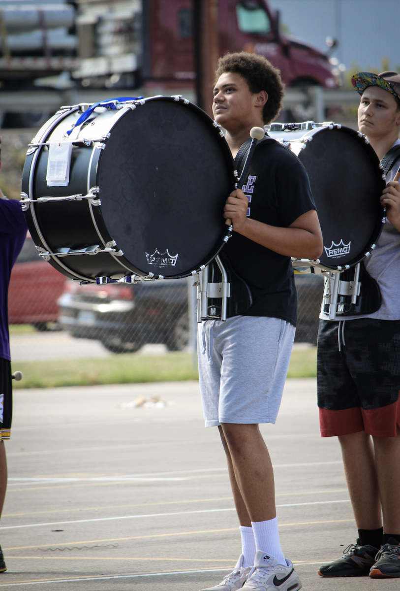 Drumming Dreams: Daniel Ernest, 15, a sophomore at Louisville Male High School, shows his drumming technique at marching band practice on Sept. 17. As he continues drumming, Ernest feels as if this instrument is a part of him. Photo by Loren Williamson.