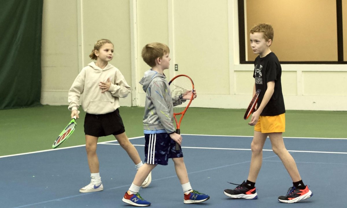 Baby Steps - Kara Slawson, 9, Brooke French, 9, and Jennings Walker, 9, play during a children’s tennis lesson on Feb. 11 at Genesis
Health Club’s Louisville Tennis Club. These young athletes are in group sessions during the off-season to develop their skills further.